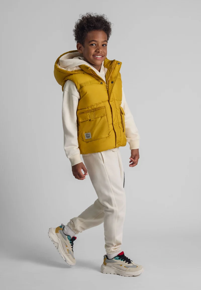 Boys' padded gilet in mustard yellow