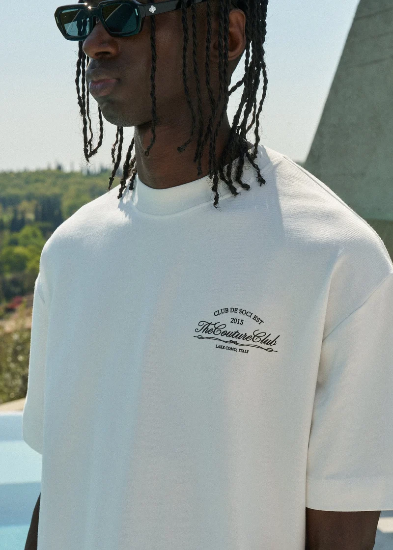 THE COUTURE CLUB T-SHIRT CLUB DE SOCI GRAPHIC T-SHIRT OFF WHITE