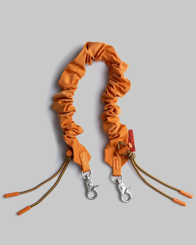 TOPOLOGIE ACCESSOIRE BUNGEE STRAP TECH SATEEN ORANJE